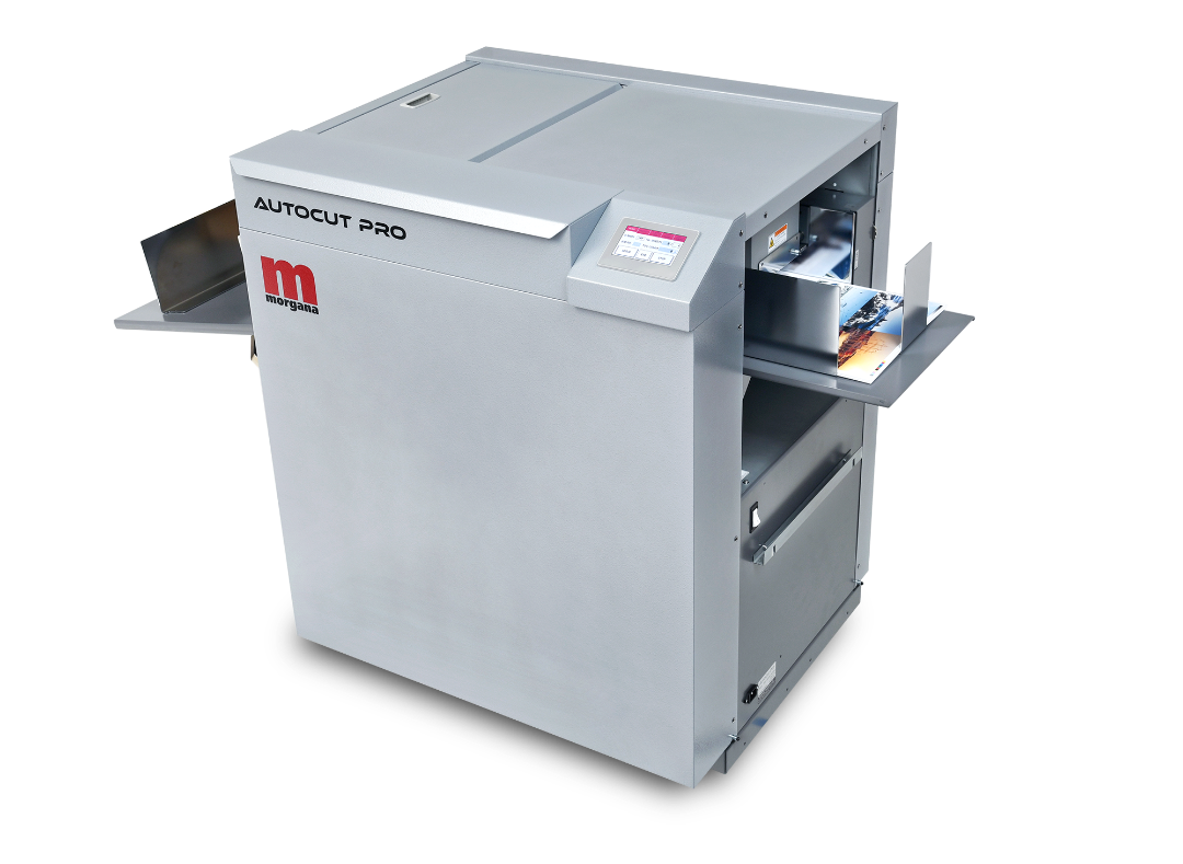 Morgana AutoCut Pro automatic slitter, cutter, and creaser with input and output trays, control panel, and compact design for precise trimming and creasing of digitally printed sheets.