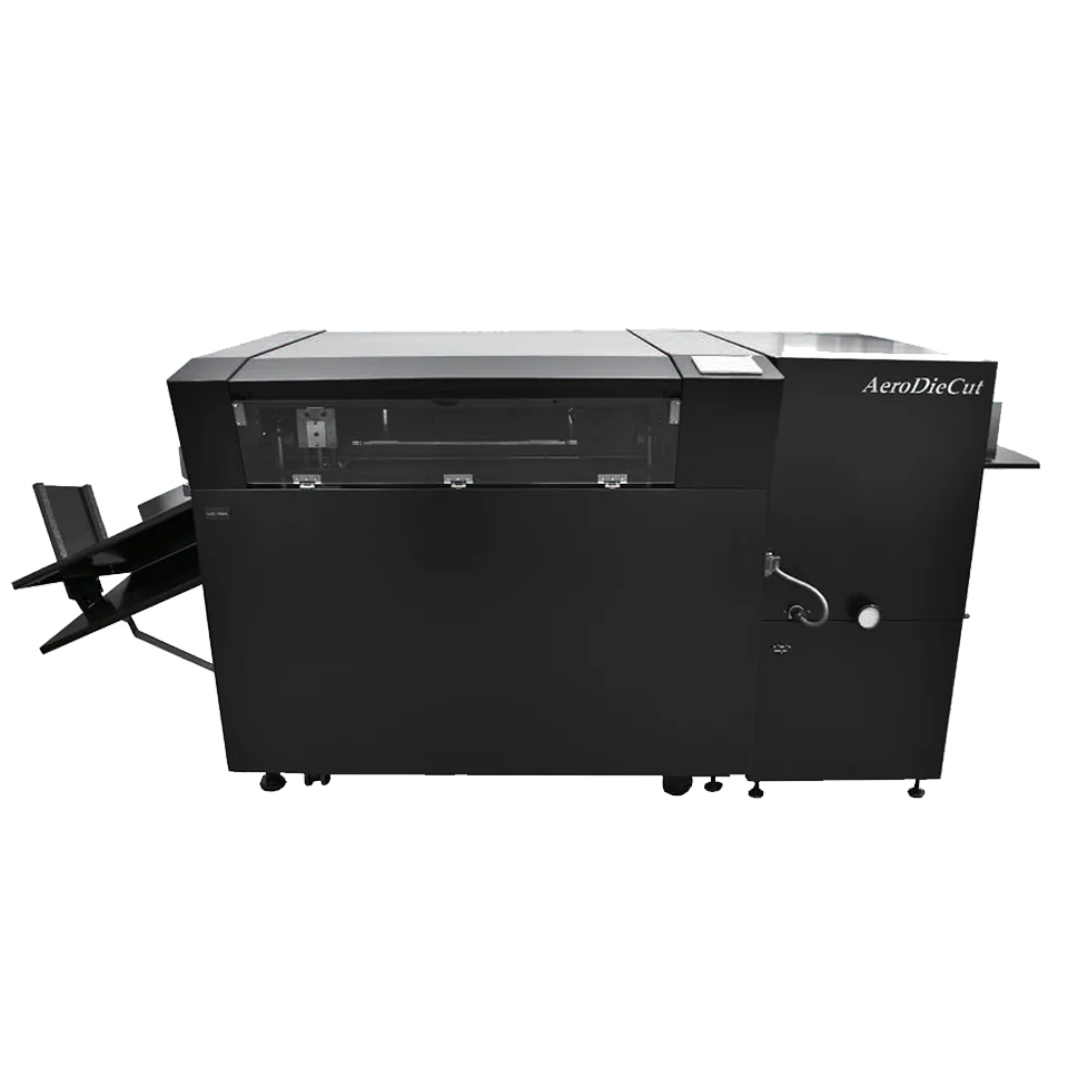 MBM AeroDieCut automatic digital die cutter in sleek black finish, shown with input and output trays extended for sheet-fed operation.