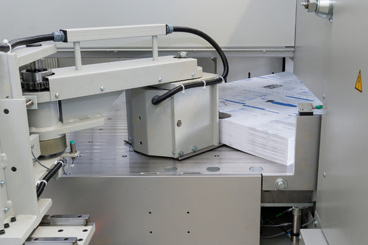 Affordable fully automatic 4-side cutting up to 30.3” x 42.1” with the BDG 3e on a BAUMANN-PERFECTA BP 132