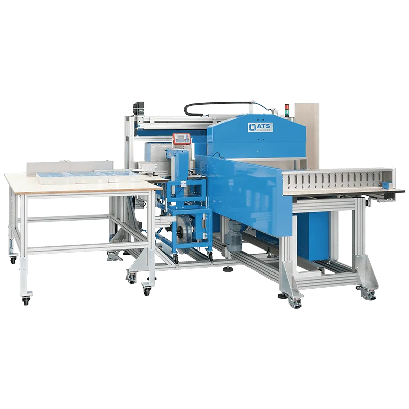 Felins US-2000 LBMMS automatic banding system with inline stacking and positioning conveyor, featuring a blue housing and integrated touchscreen controls.
