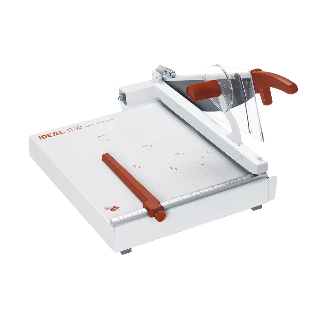 Triumph 1138 tabletop paper trimmer with safety guard, ergonomic red handle, adjustable back gauge, and printed cutting guide on a sturdy metal base.