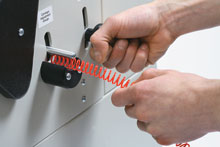 Coil diameter adjustment provides for proper carriage positioning