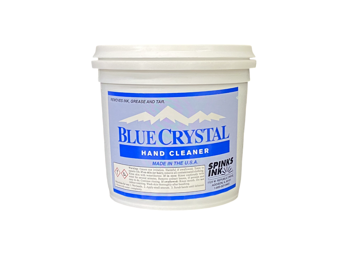 A white plastic tub with a blue lid labeled 'Blue Crystal Hand Cleaner' by Spinks.