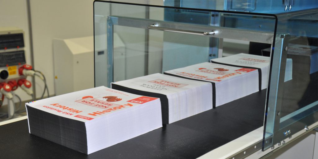 Roll to book block exit conveyor
