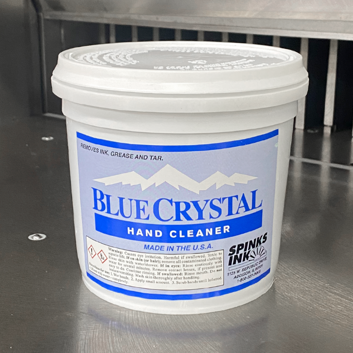 Spinks Blue Crystal Hand Cleaner [2 Quarts] tub set on paper cutter table