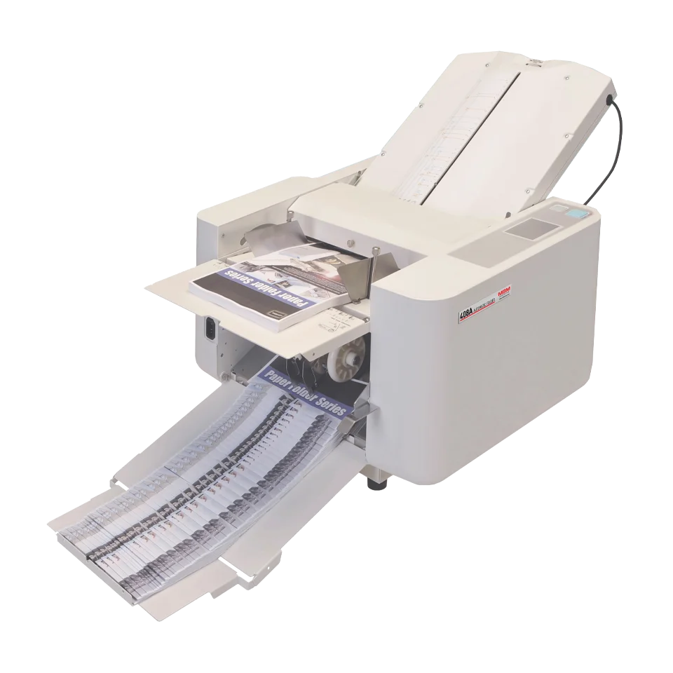An MBM 408A automatic paper folder machine with paper exiting the folder tray, predominantly in white and gray colors.