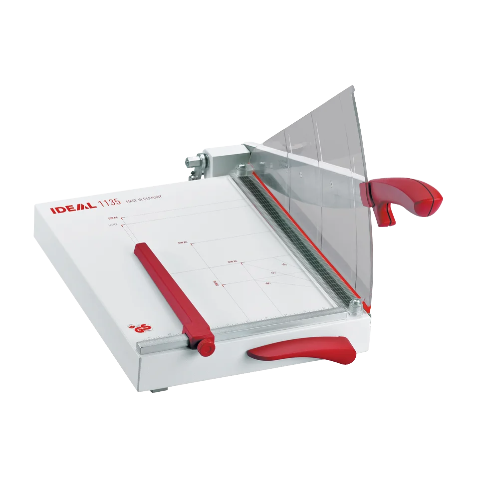 Triumph 1135 Tabletop Trimmer with red handle, transparent blade guard, and printed cutting grid on the surface for precise trimming.