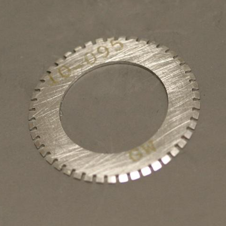 A close-up of a silver-colored perforation blade with '16-095' and 'GW' engraved on it, indicating the model number and brand respectively.