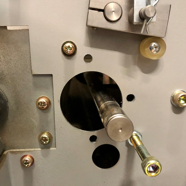 Close-up view of the Horizon VAC Series Side Frame Repair Kit, showing internal hardware components, mounting screws, and a replacement bearing shaft assembly.